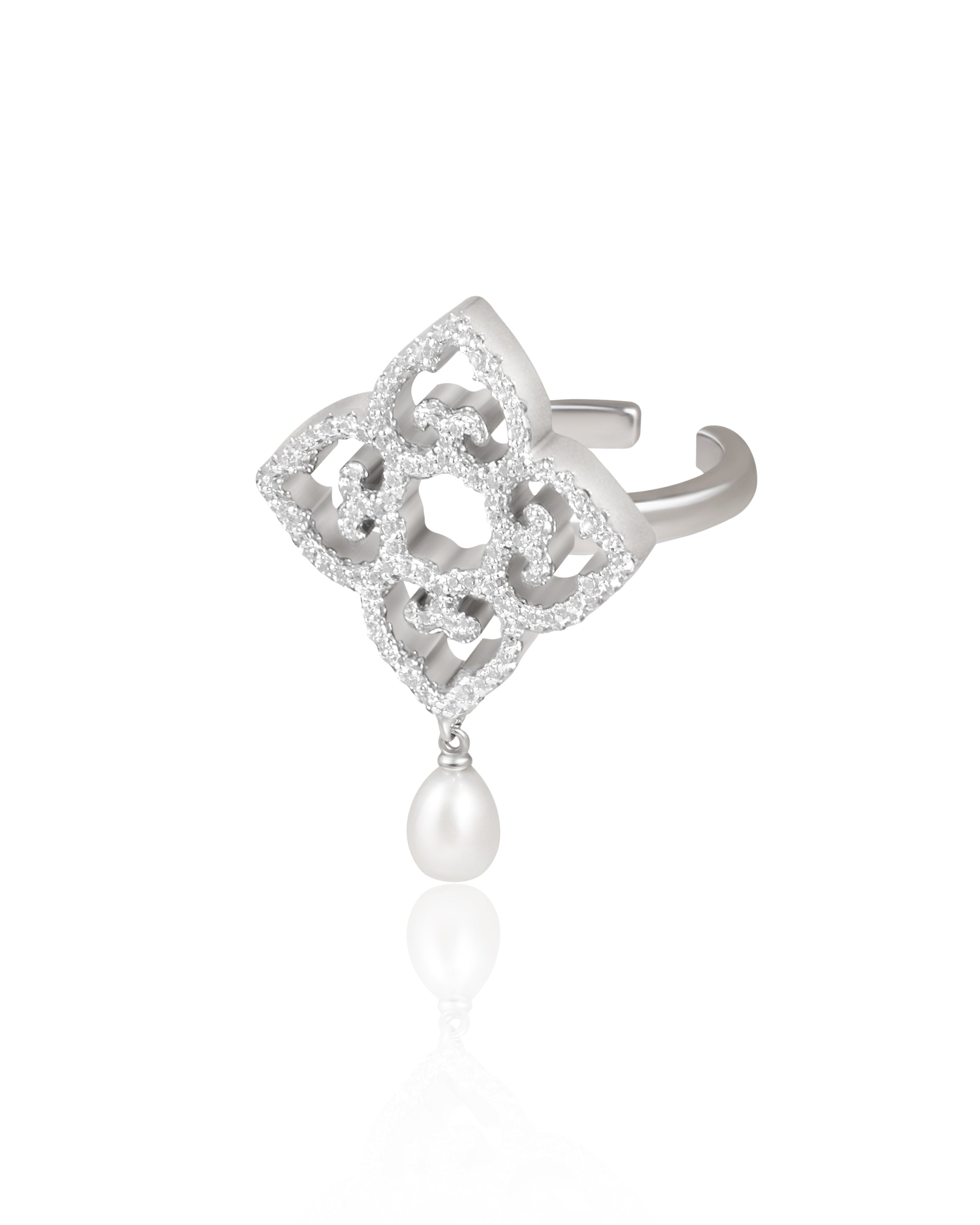 Silver ring with diamond accents and a pearl drop on a white background