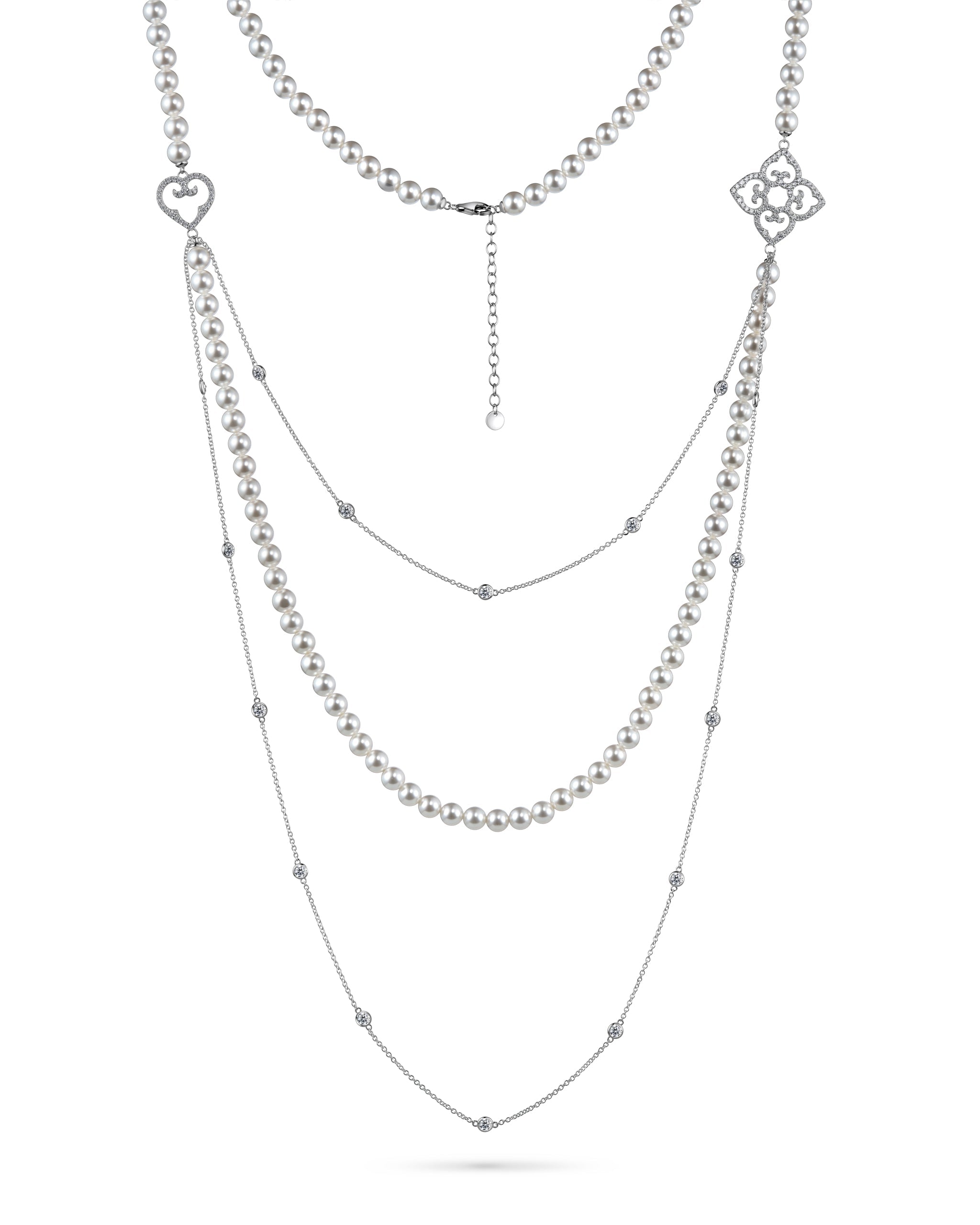 Layered silver necklace with heart and floral pendants on a white background